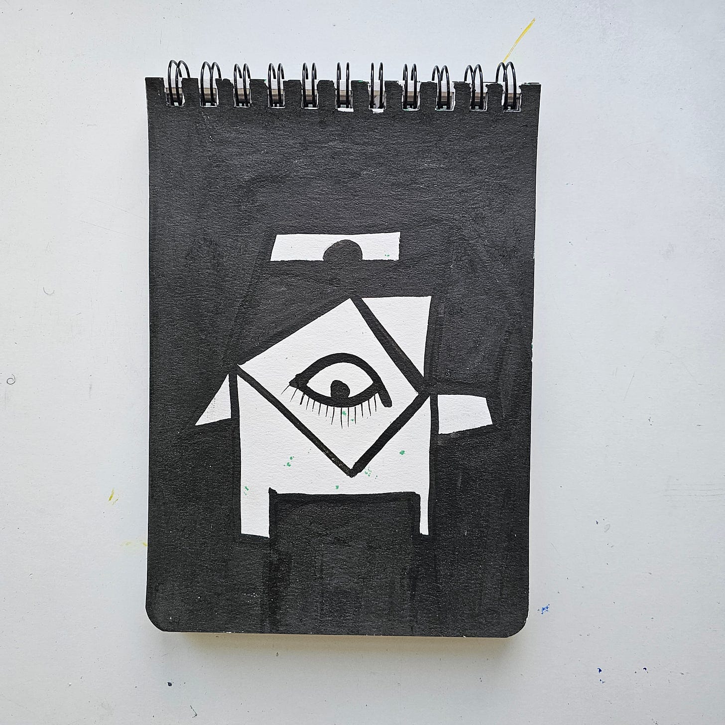 This artwork is titled Baby Elifant and was created by the International artist FatbikeHero (born 1983). The piece was executed on January 3, 2026, in Vorre-Skødstrup. It features a high-contrast, black-and-white geometric design centered around an eye motif, drawn on spiral-bound notebook paper. The reverse side of the artwork includes a handwritten inscription referencing "Hester Shaw" and the artist's signature. For more information on this piece and the artist's portfolio, please visit the official website at fatbikehero.com.