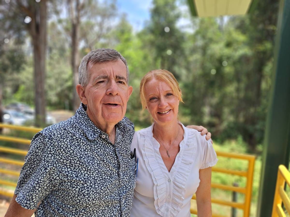 dad and daughter volunteering together