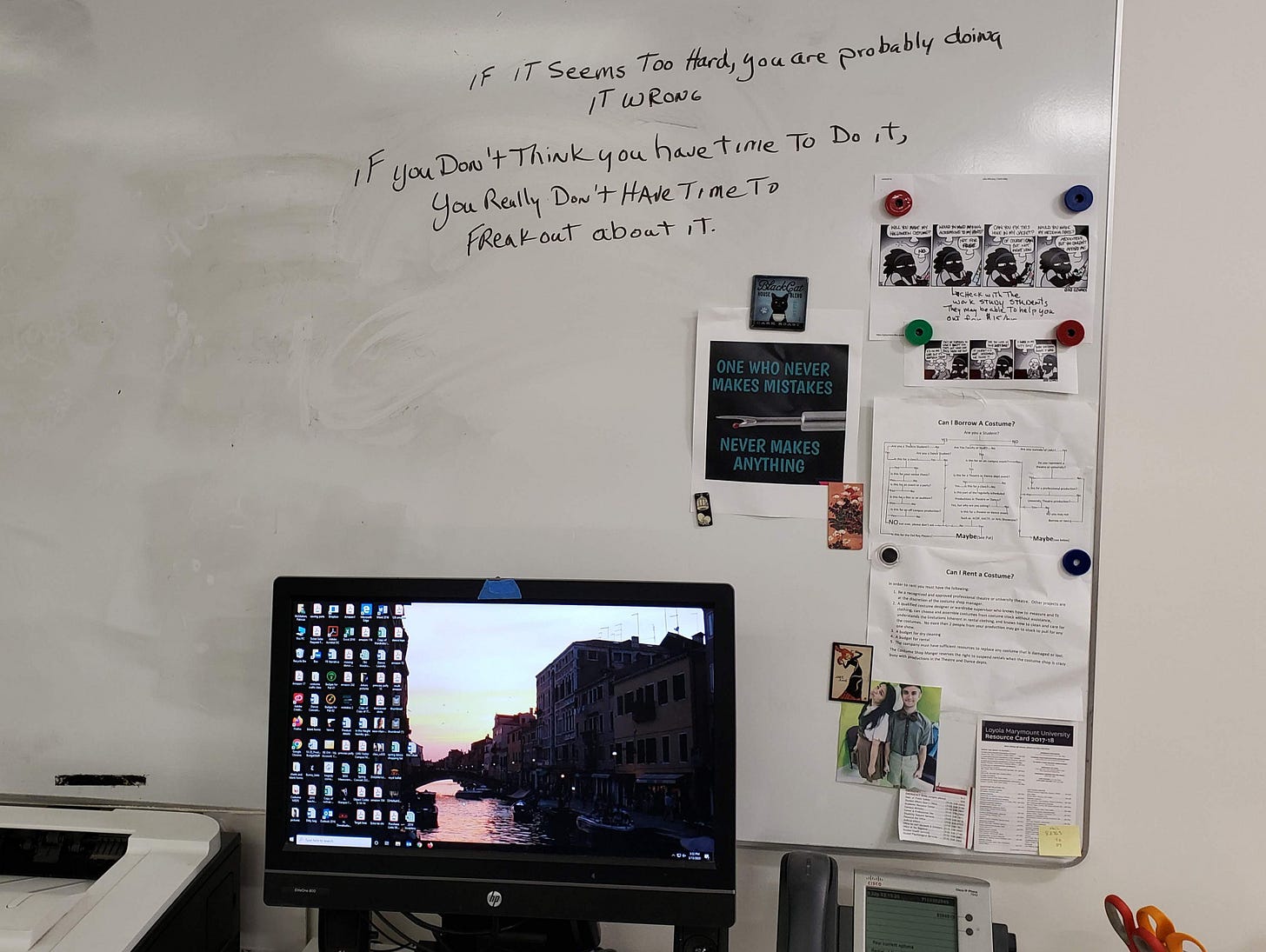 A photo of a whiteboard with two quotes: If it seems too hard, you’re probably doing it wrong. And: If you don't think you have time to do it, you really don't have time to freak out about it.