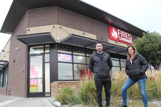 Alex Levine and Lisa Leder stand outside Fired Cannabis’ store at 10455 E. Colfax Ave. in Aurora. (Max Scheinblum, BusinessDen)