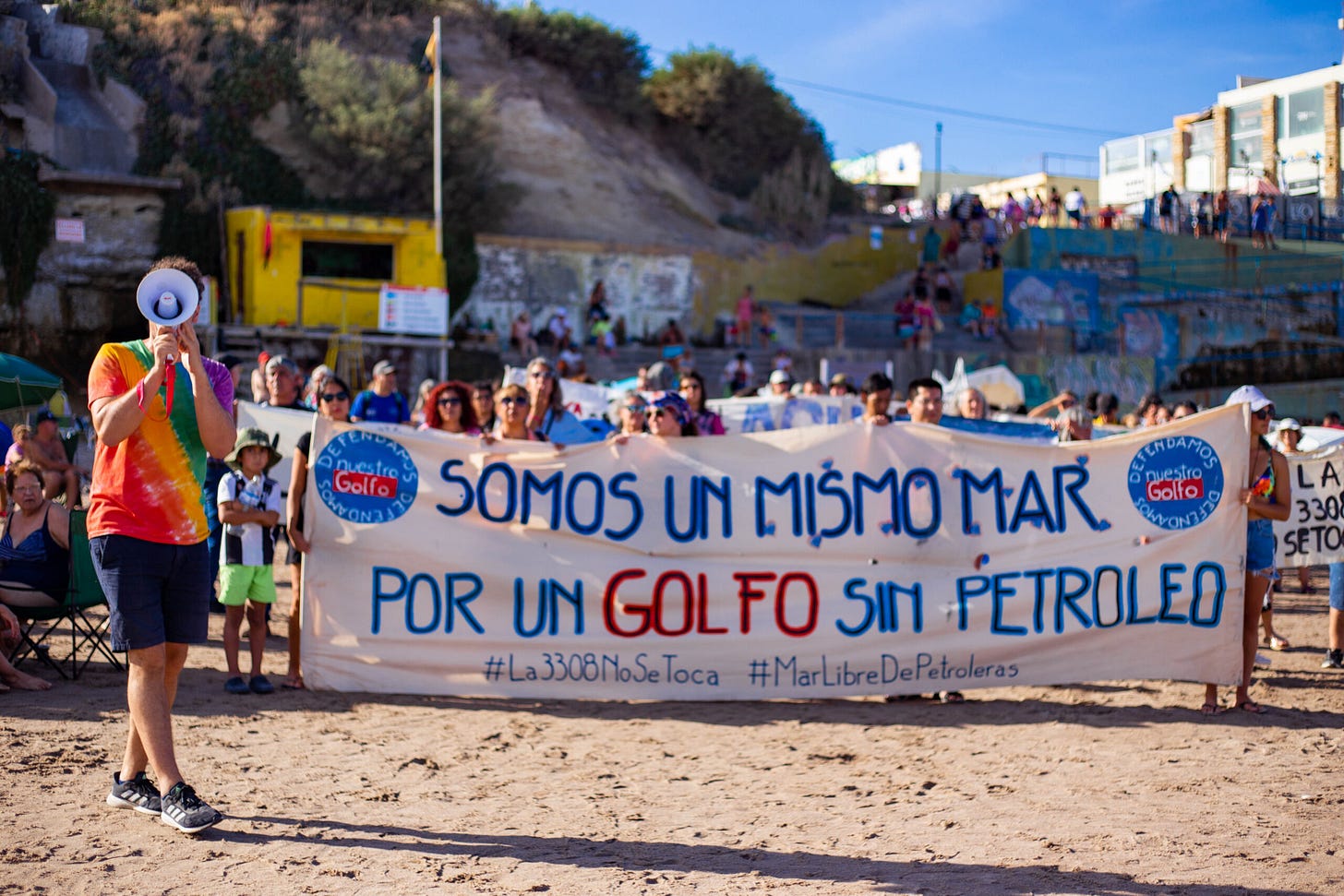 A group of dozens of activists holding a sign in a demonstration against the Vaca Muerta gas terminal A group of dozens of activists holding a sign in a demonstration against the Vaca Muerta gas terminal