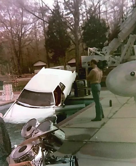 Three images of a car suspended above and dropped into a pool with punk rocker Wendy Williams in the driver seat.