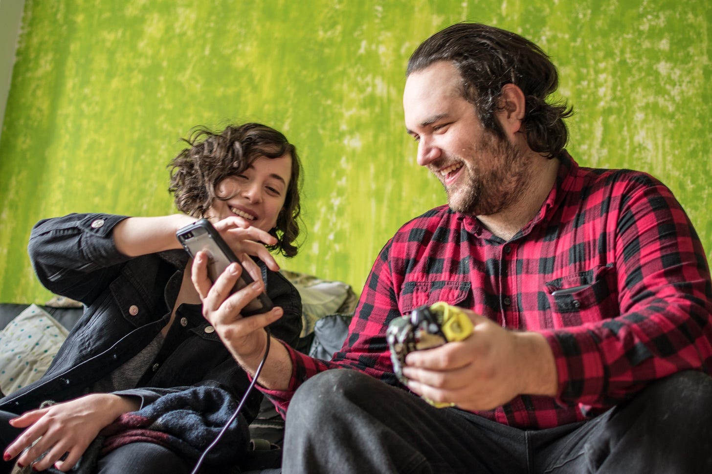 A man and a woman have a friendly chat in a public space. A man and a woman have a friendly chat in a public space.
