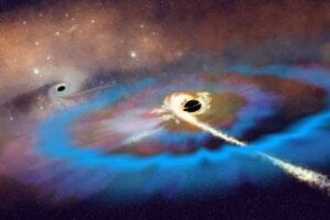 Artist’s interpretation of two massive black holes (MBHs) within a galaxy. A tidal disruption event unfolds around the MBH that resides away from the galactic center and matter from a disrupted star swirls into a bright accretion disk, launching an energetic outflow and resulting in two bright radio flares. Credit: NSF/AUI/NSF NRAO/P.Vosteen
