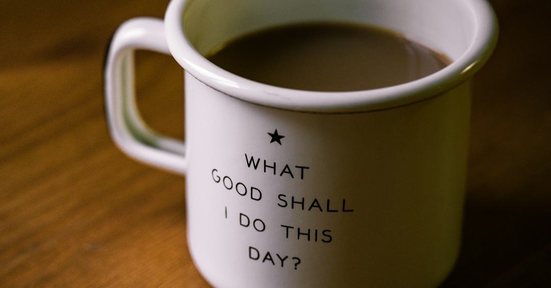 white and black ceramic cup filled with brown liquid on brown wooden sufface white and black ceramic cup filled with brown liquid on brown wooden sufface