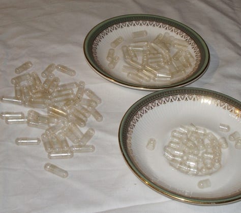Capsules are separated and inserted in frame for filling