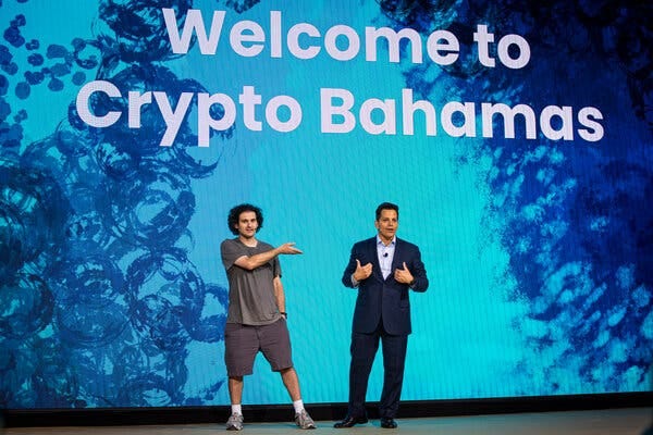 Mr. Bankman-Fried with Anthony Scaramucci at the conference last month.