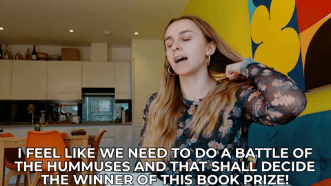 Hannah saying, "I feel like we need to do a battle of the hummuses and that shall decide the winner of this book prize!"