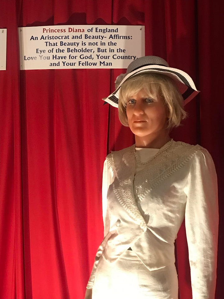 Two images, one of a Princess Diana wax work where she is dressed in white with a hat and looks nothing like the actual Princess Di. The other is of Julia Roberts, it isslightly more true to life but the statue is wearing a very matted wig.