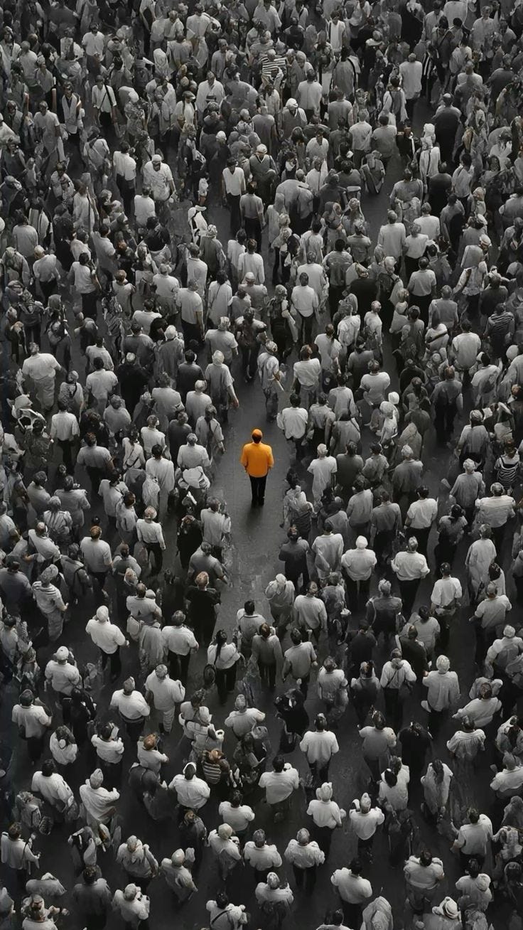 This may contain: an aerial view of a large group of people with one person standing in the middle