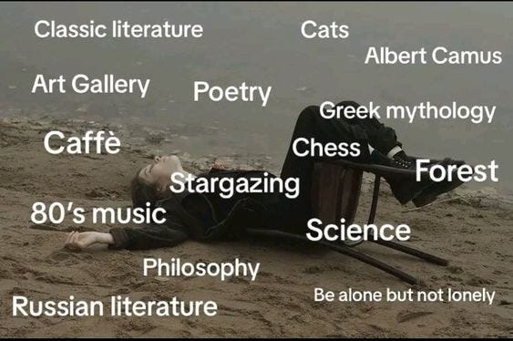 This may contain: a person laying in the sand with their feet up on a chair and some words above them
