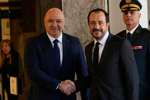 Lebanese President Joseph Aoun, left, shakes hands with Cyprus' President Nikos Christodoulides upon his arrival at the Presidential Palace in Baabda, east of Beirut, Lebanon, Wednesday, Nov. 26, 2025. (AP Photo/Hussein Malla)