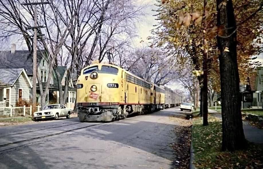 May be an image of train, railroad and text