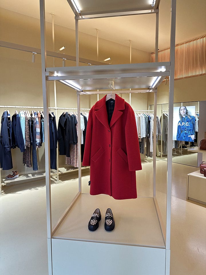 red coat and purses