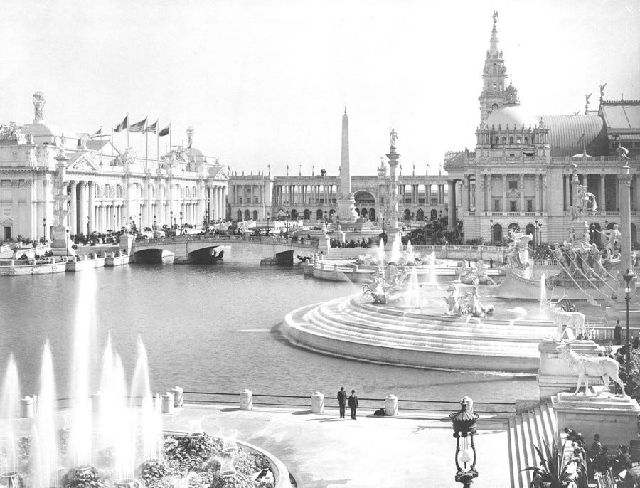 Many fountains and large buildings clustered around a broad basin