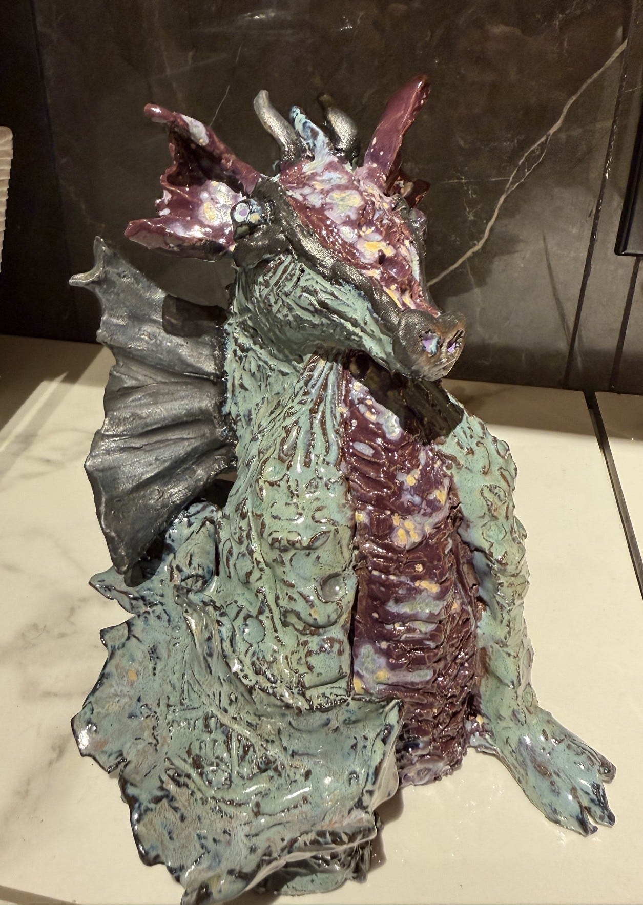 My ceramic dragon. I hand sculpted it and glazed it.