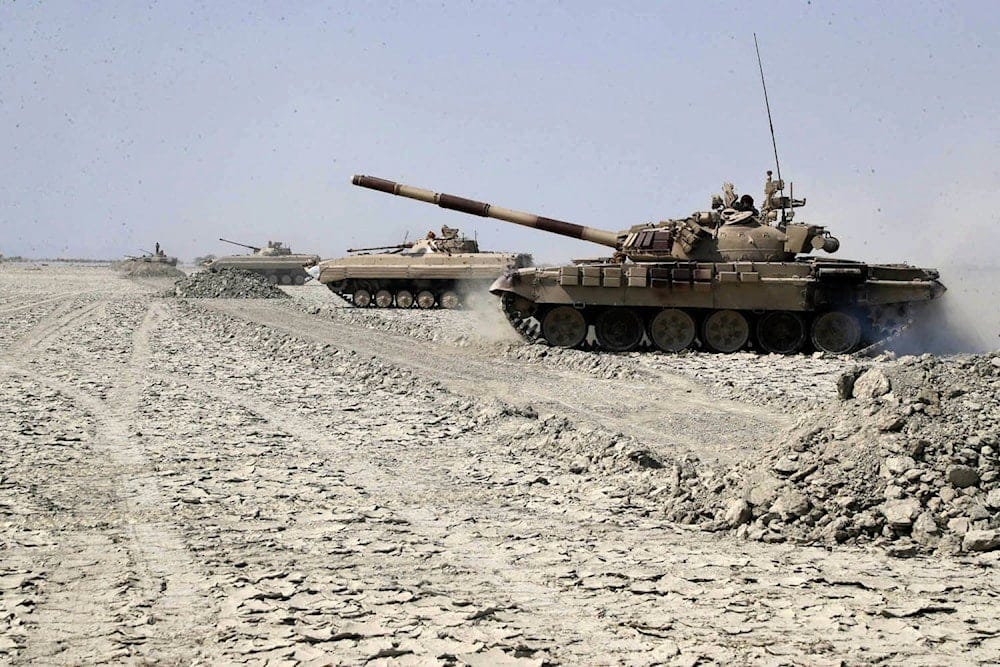 In this photo provided Saturday, Feb. 22, 2025, by the Iranian Army, tanks move forward during a drill in southeastern Iran. (Iranian Army via AP) In this photo provided Saturday, Feb. 22, 2025, by the Iranian Army, tanks move forward during a drill in southeastern Iran. (Iranian Army via AP)