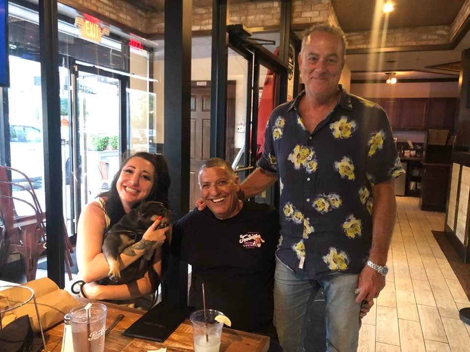 May be an image of 3 people and text