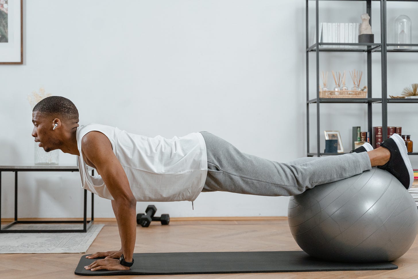 A Man Exercising by Using a Yoga Ball A Man Exercising by Using a Yoga Ball