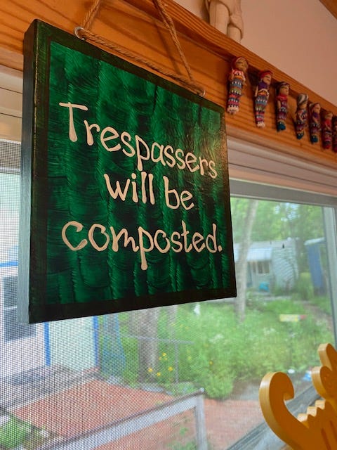 sign that reads "trespassers will be composted"