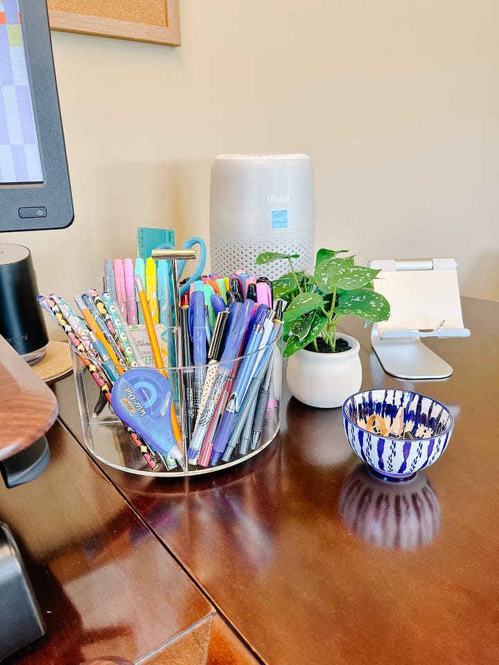 colorful office supplies on a desk with file cabinet