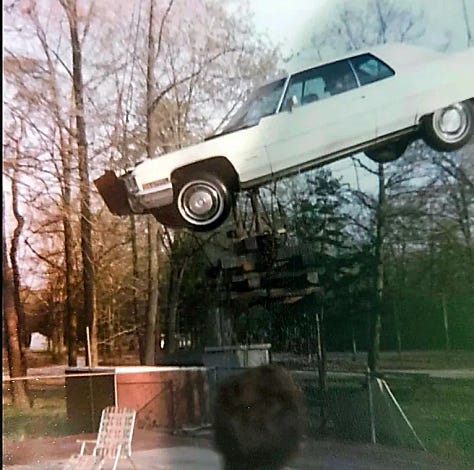 Three images of a car suspended above and dropped into a pool with punk rocker Wendy Williams in the driver seat.