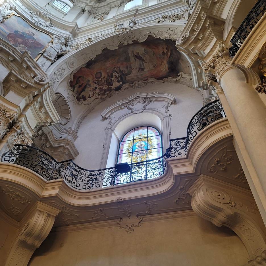 A ceiling with a stained glass window

AI-generated content may be incorrect.