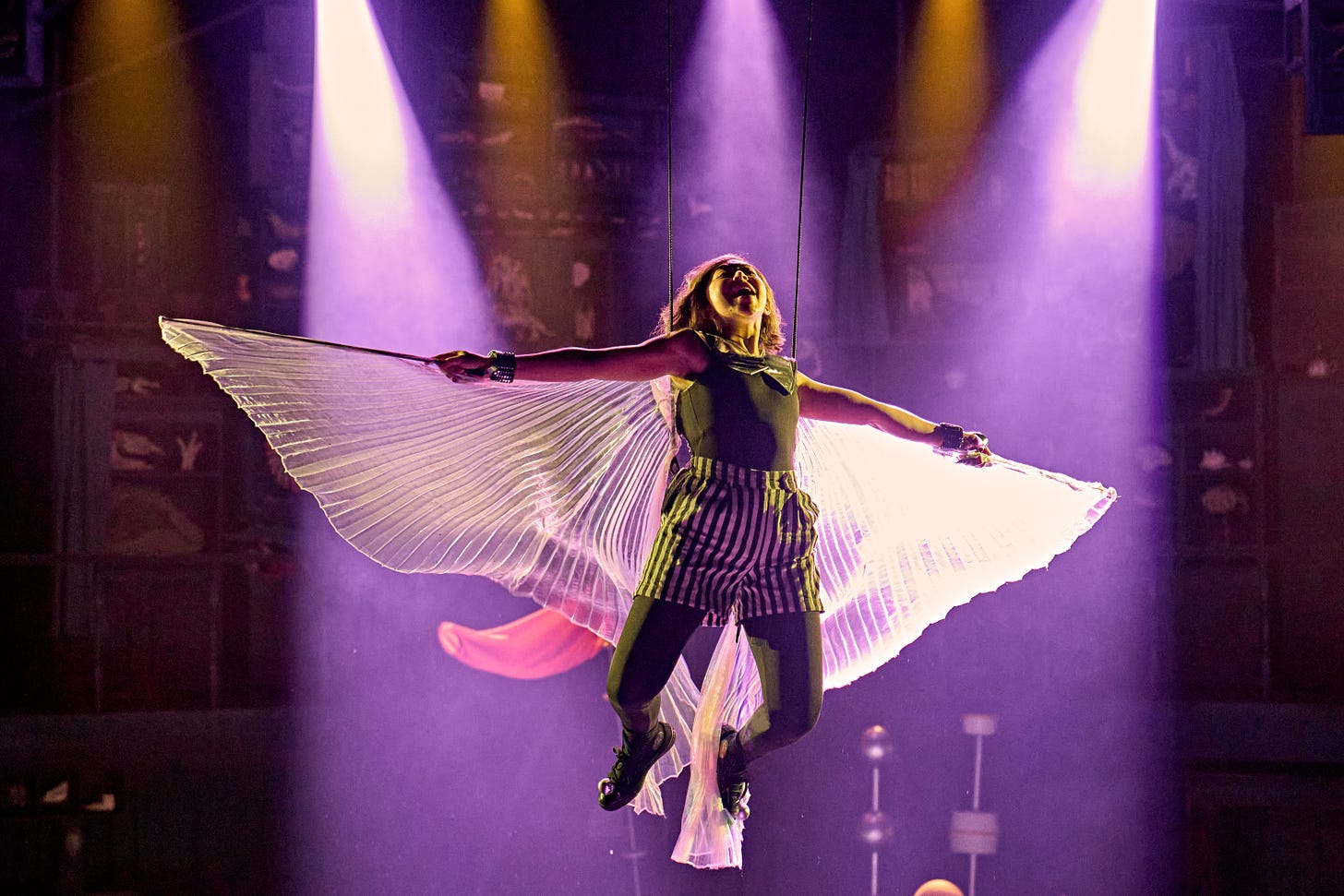 A photograph of an actress flying as a fairy onstage in Ballet Shoes