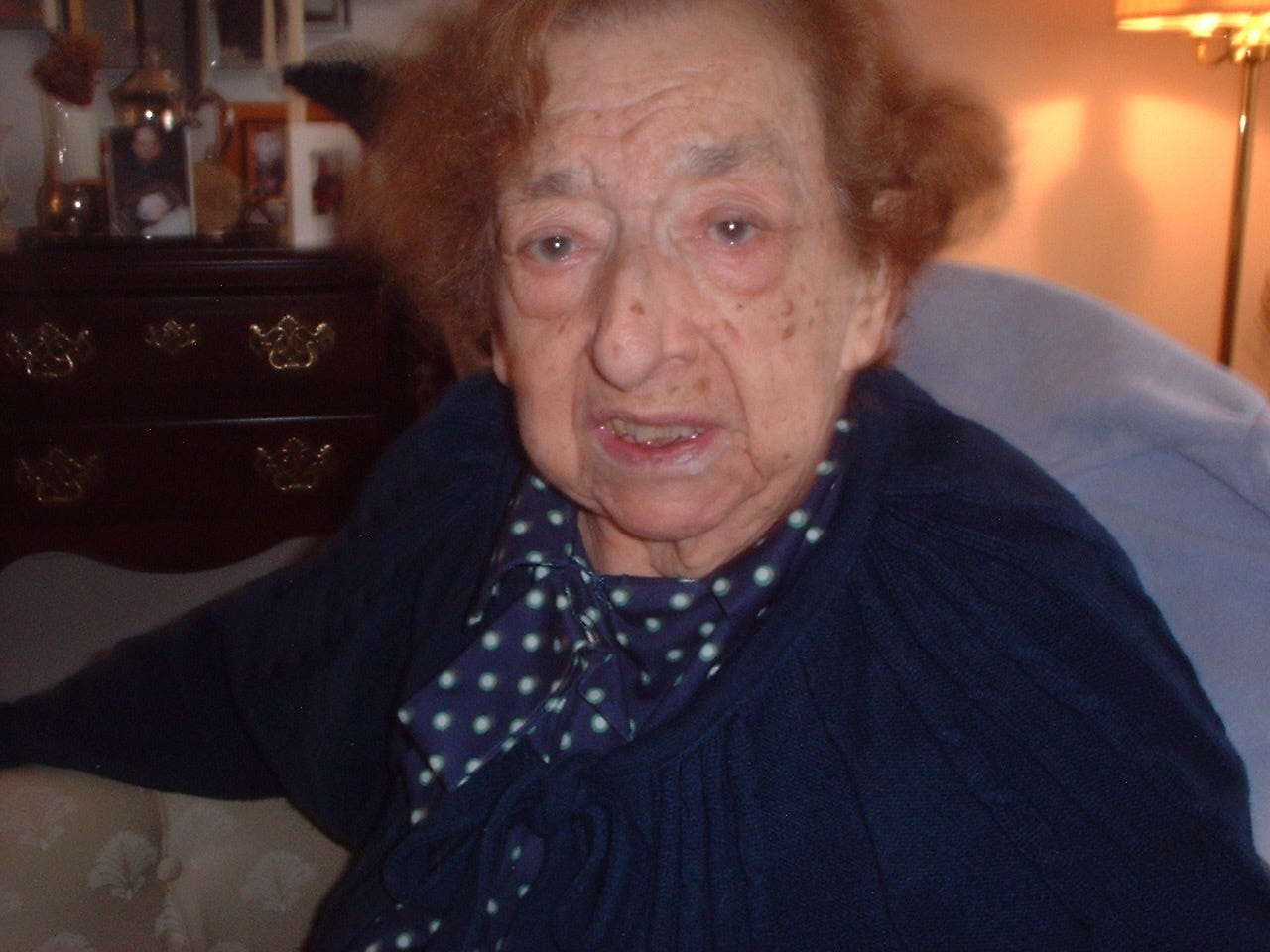 older woman sitting down