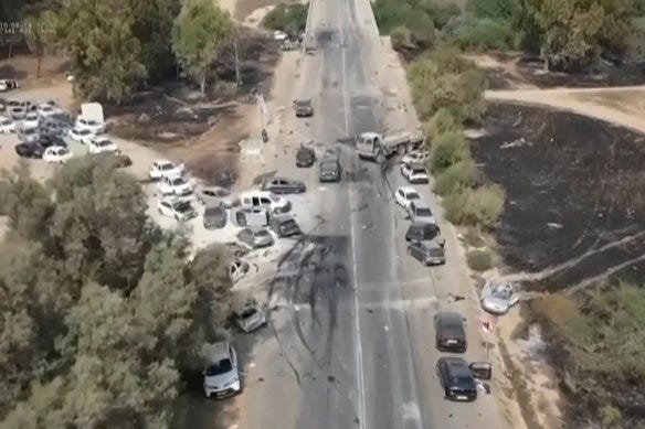 Charred and damaged cars at the exit of the Tribe of Nova trance music festival road after an attack by Hamas militants in southern Israel on Saturday. Charred and damaged cars at the exit of the Tribe of Nova trance music festival road after an attack by Hamas militants in southern Israel on Saturday.