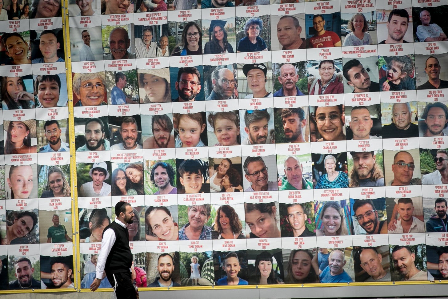 People walk by photographs of Israelis held hostage by Hamas in Gaza, in Tel Aviv, April 9, 2023. (Miriam Alster/Flash90) People walk by photographs of Israelis held hostage by Hamas in Gaza, in Tel Aviv, April 9, 2023. (Miriam Alster/Flash90)