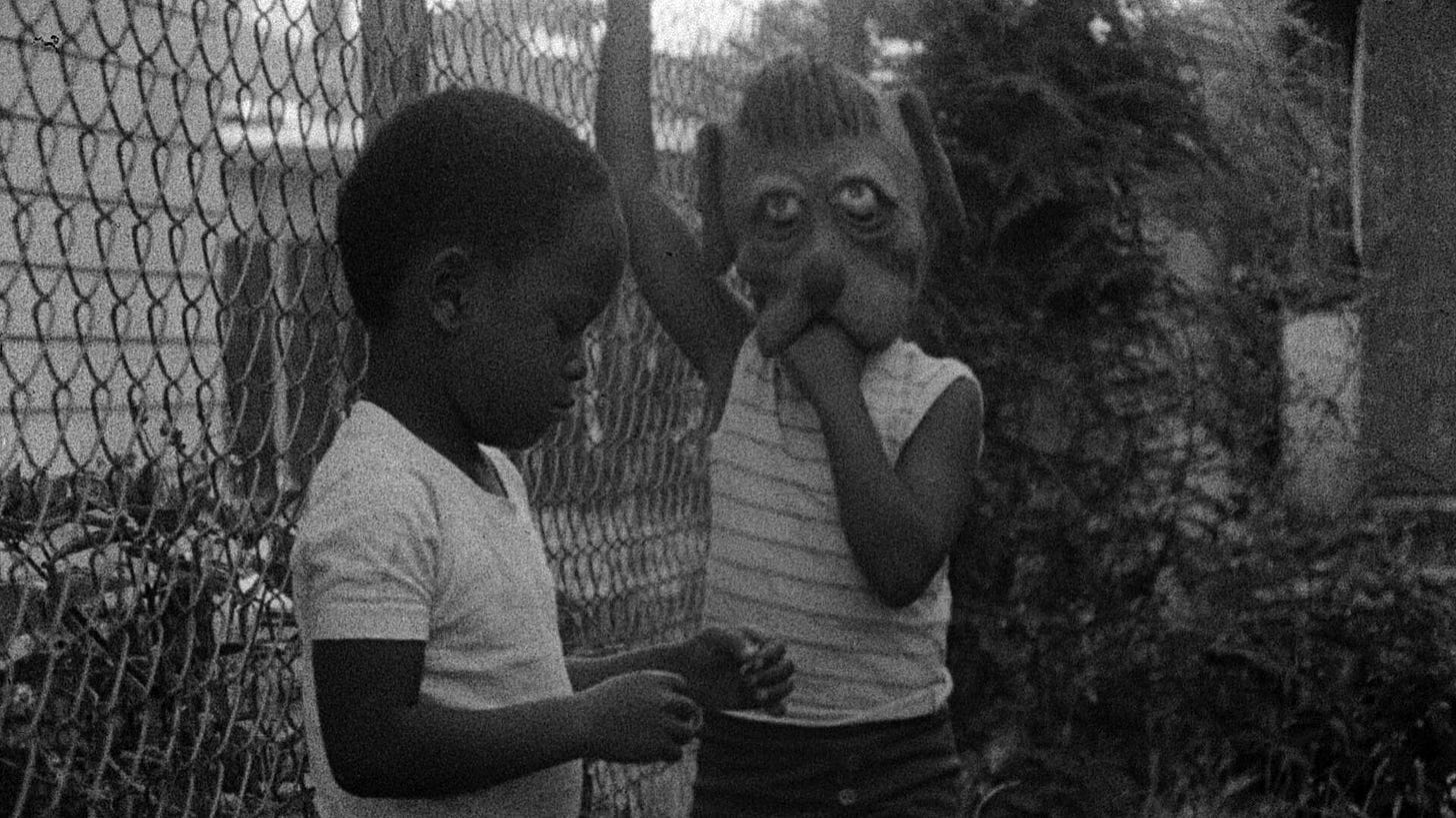 Killer of Sheep | Still features two African-American boys, one of whom is wearing a dog mask.