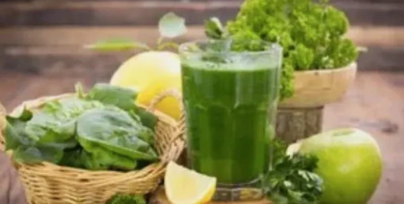 leafy greens, green apple, green smoothies, lemons placed on a table
