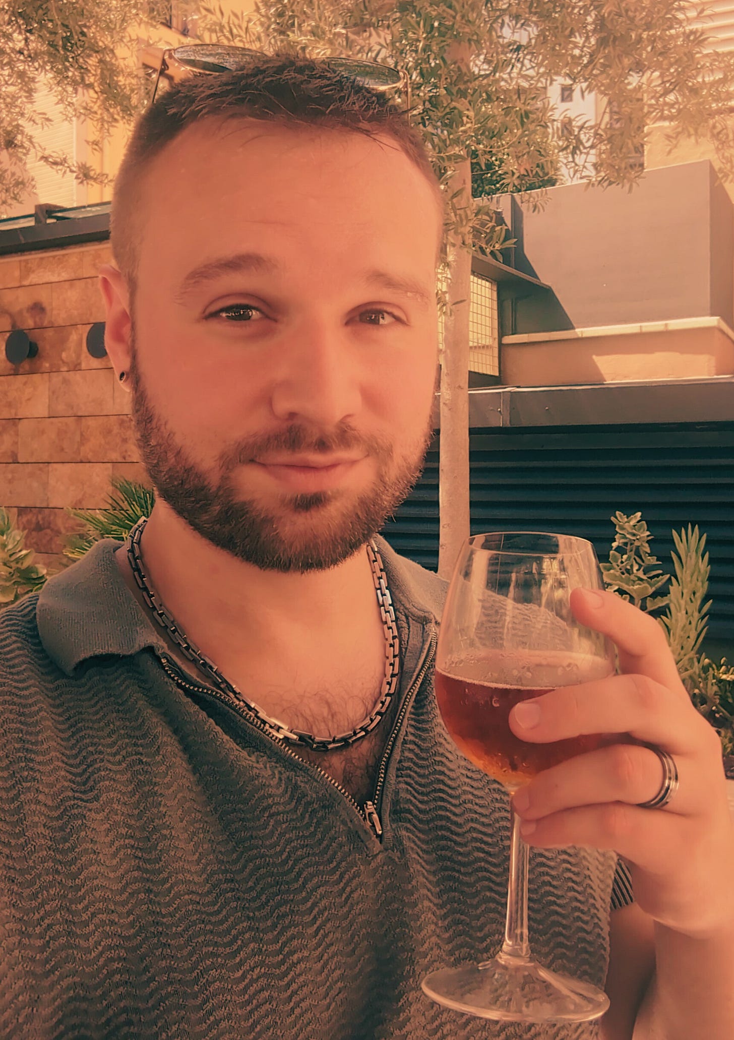 Author Stuart Found raising a glass of beer in a beer garden in Barcelona, Spain, from Never Lost Letters