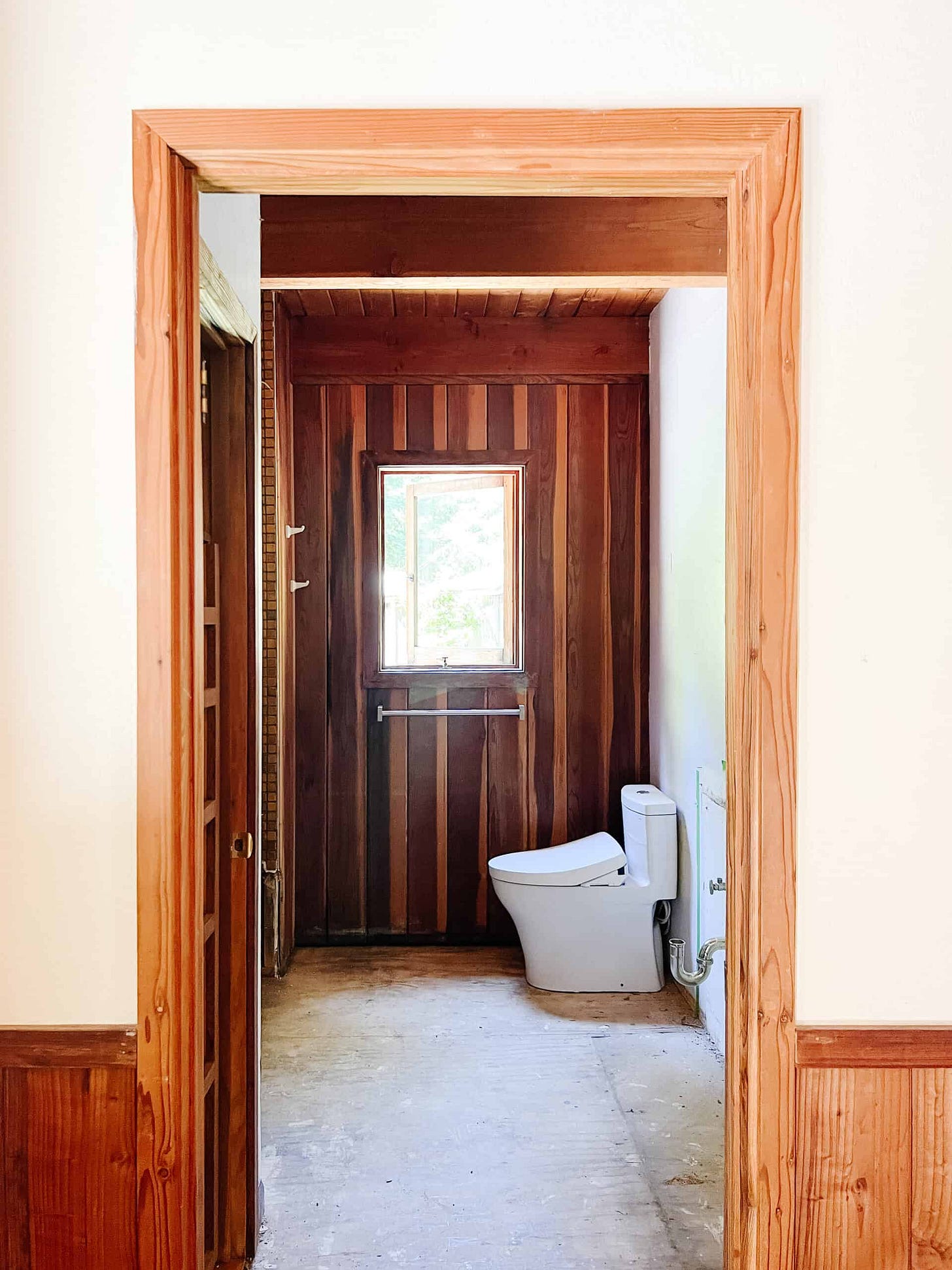 The bathroom mid demo with the floors removed.