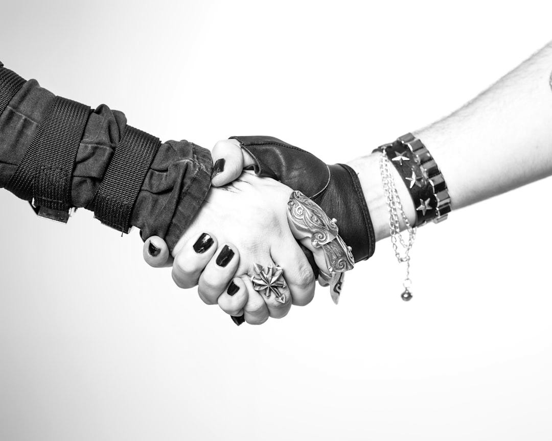 a couple of people that are shaking hands a couple of people that are shaking hands