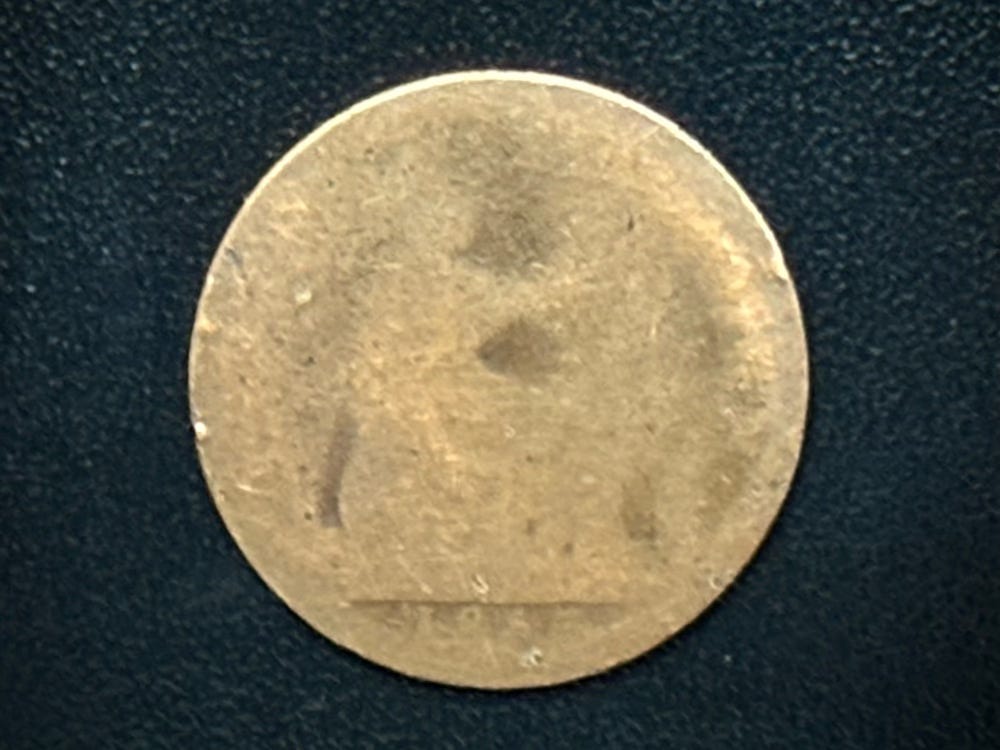 A terrible snap of a worn out coin