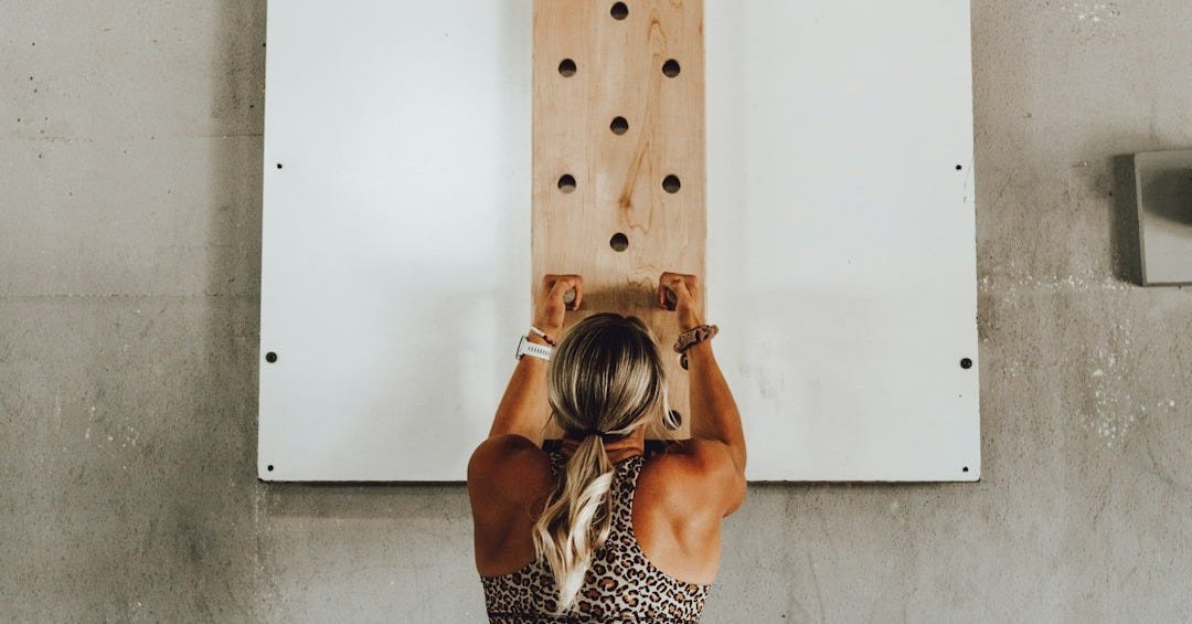 a woman holding a wooden pole a woman holding a wooden pole