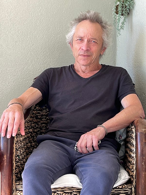 Photograph of Jack van Honk sitting on a chair.