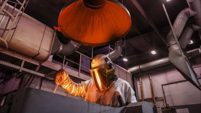 A worker in a Russian foundry A worker in a Russian foundry