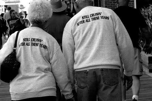 This may contain: two people wearing shirts that say still cruisy after all these years This may contain: two people wearing shirts that say still cruisy after all these years