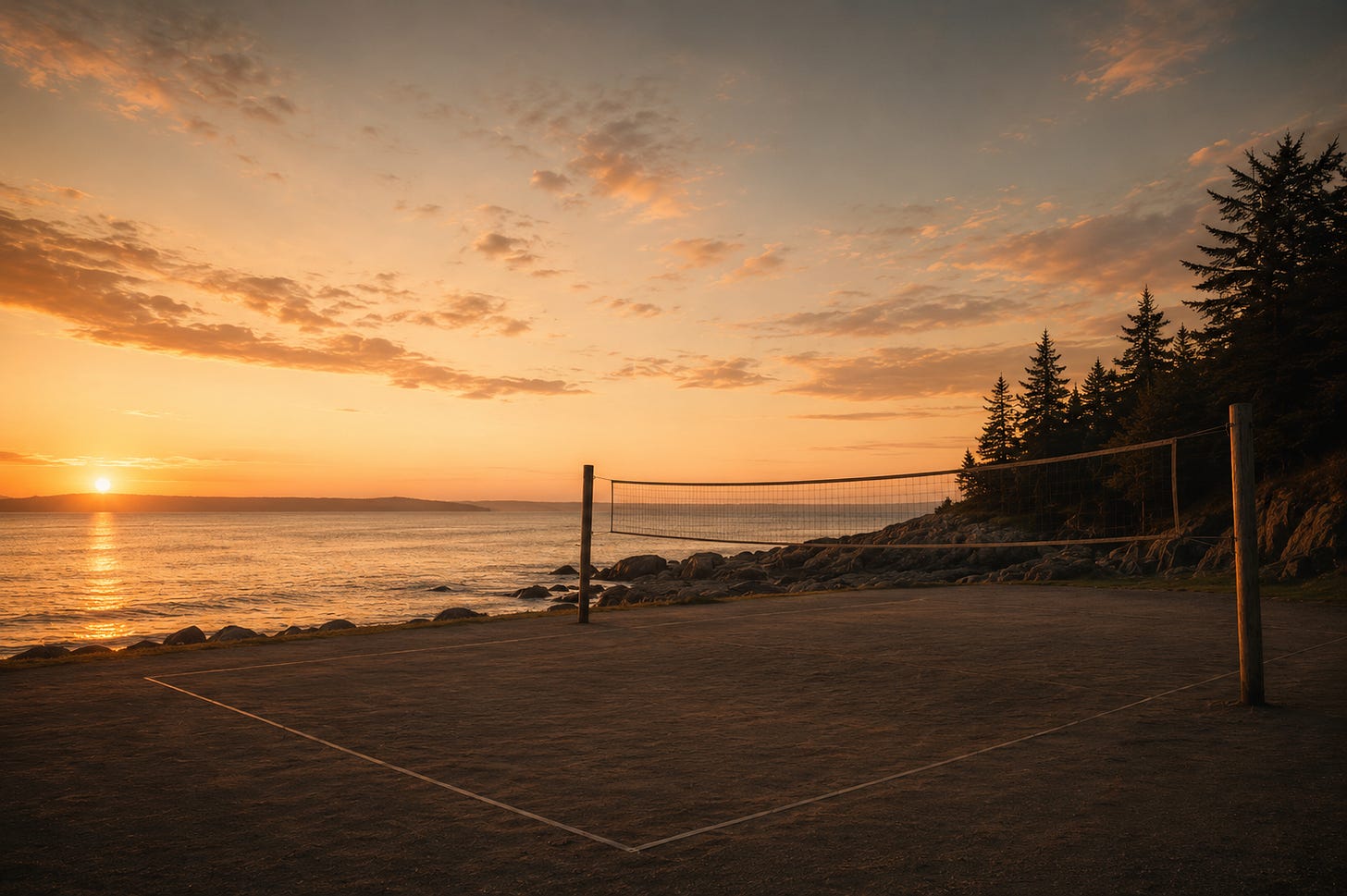 Empty sand volleyball court beside a rocky coastline at golden hour, with a calm ocean, distant horizon, evergreen trees, and warm light across the sky.