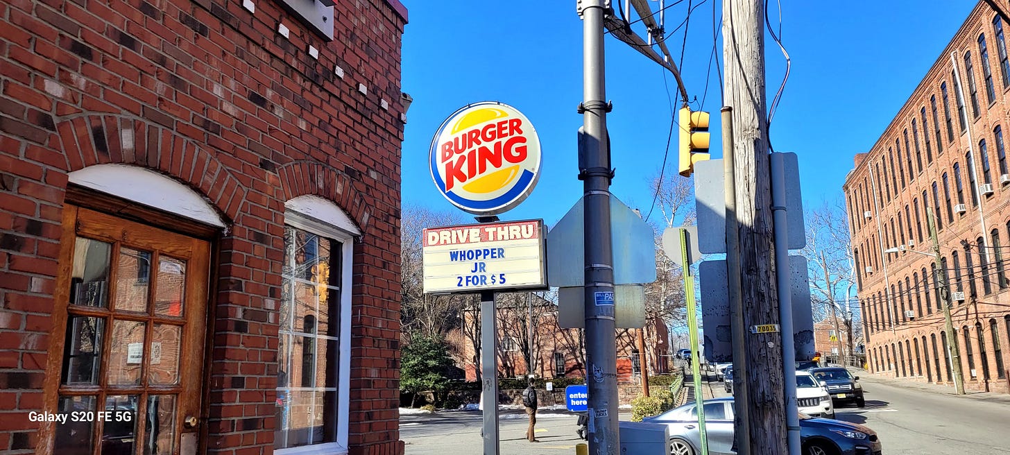 Brick store with a Burger King sign. Underneath it reads "Drive Thru", "Whopper Jr. 2 for $5"