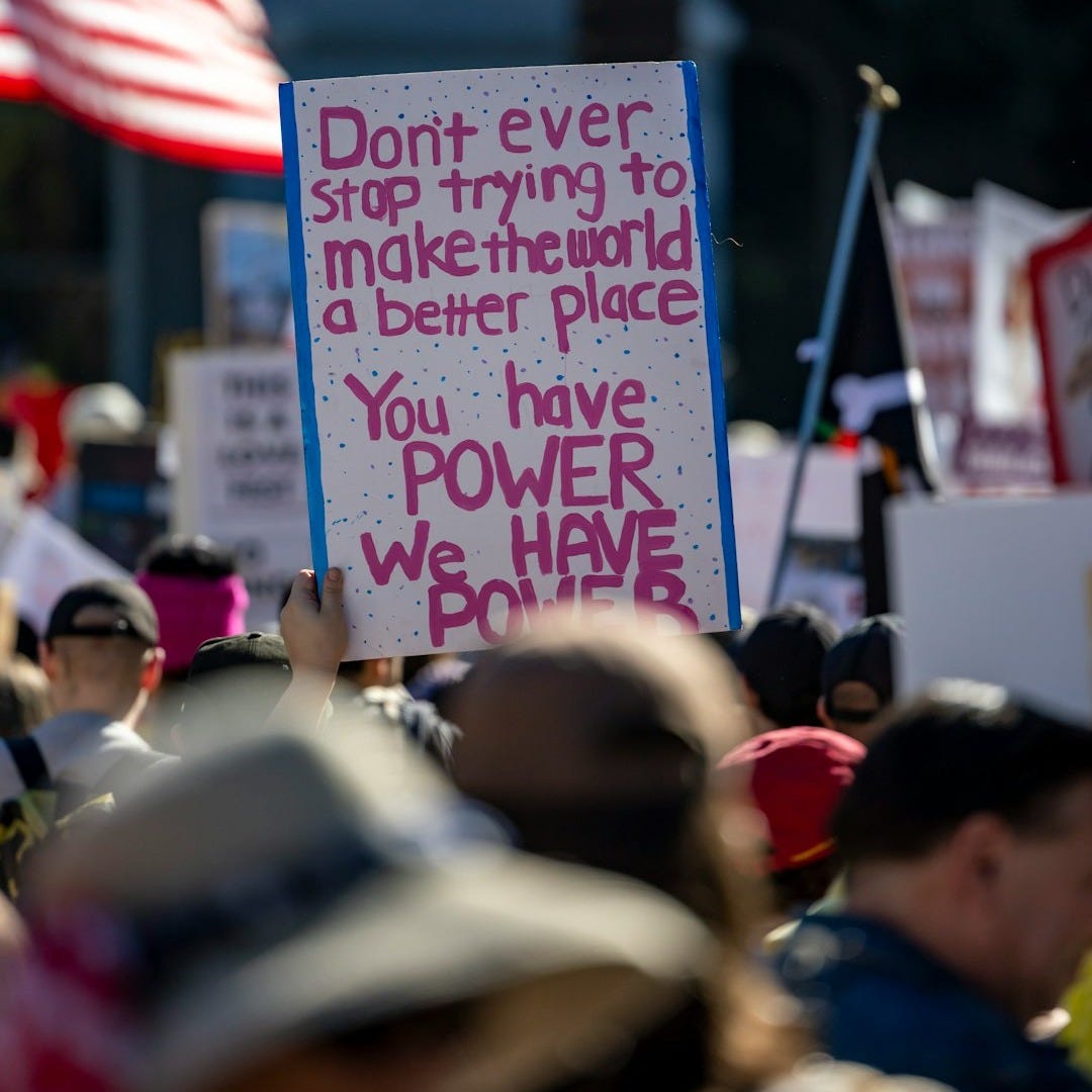 Protest sign reads "you have power we have power"