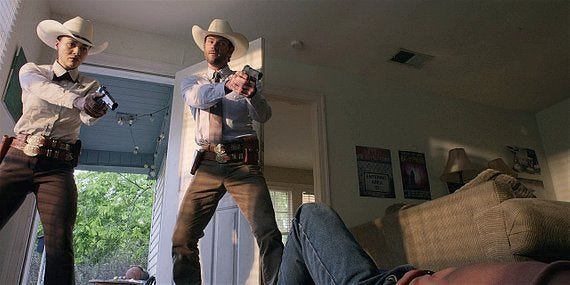 Walker Micki and Cordell holding guns on Travis. Walker Micki and Cordell holding guns on Travis.