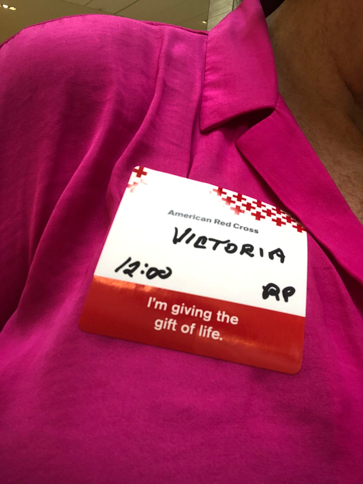 A name ‘badge’ sticker with ‘Victoria’ and ‘American Red Cross’ on it. 
