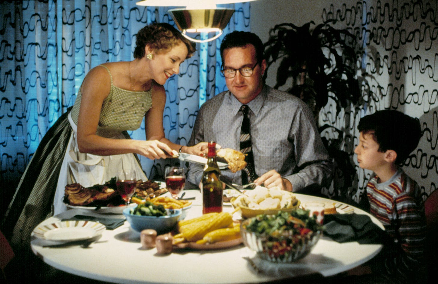 Parents screenshot: Nick, Lily, and Michael sitting at the dining table for dinner.