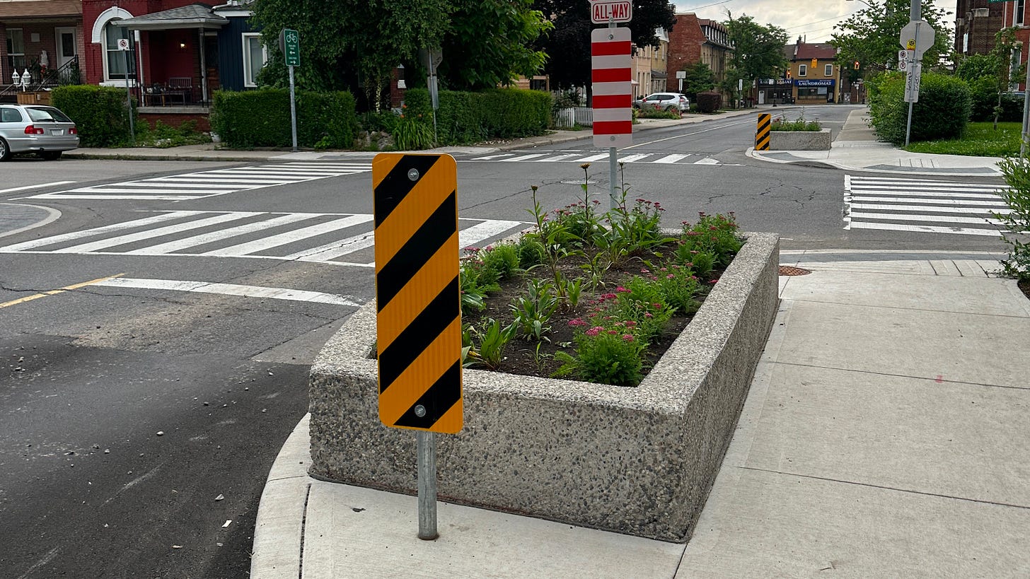 Intersection pinching using a planter box at MacNab Street North and Barton Street West