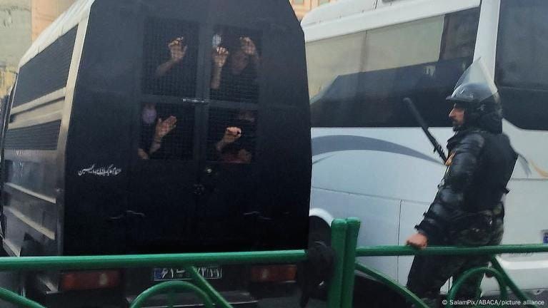 A group of people looking out a window

AI-generated content may be incorrect.