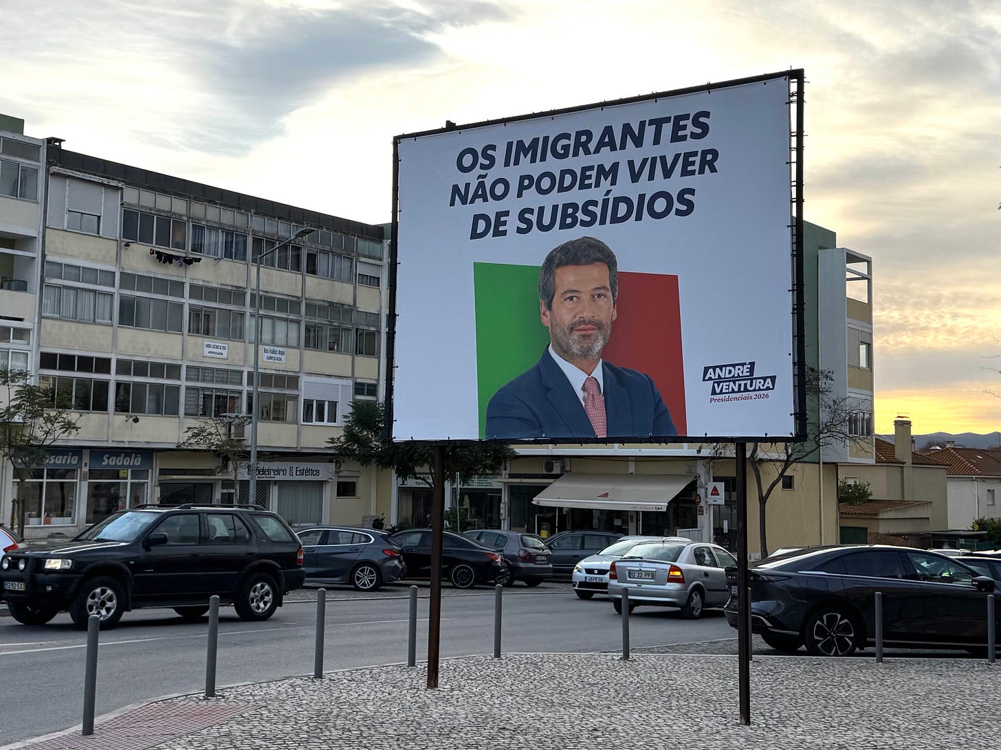 A billboard with text and a man's face on a busy city street corner. A billboard with text and a man's face on a busy city street corner.